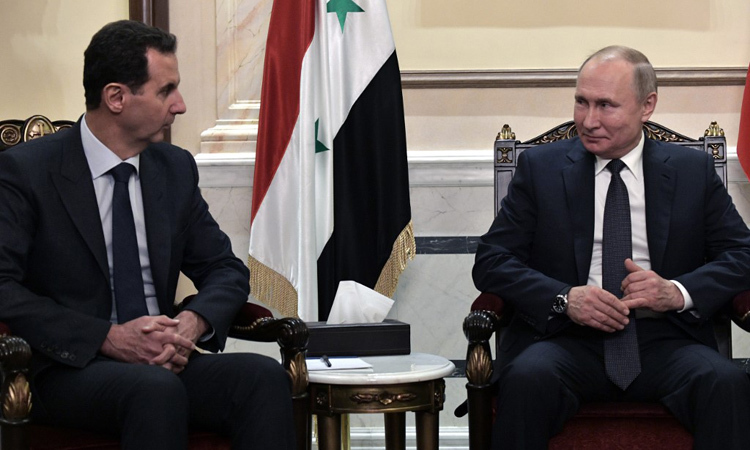 Tổng thống Nga Vladimir Putin (phải) gặp người đồng cấp Syria Bashar al-Assad tại Damacus hôm 7/1. Ảnh: AFP.